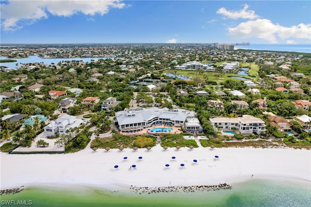 birds eye view of property featuring a water view and a view of the beach