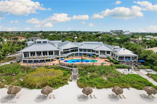 375 Periwinkle Ct, Marco Island, FL 34145 - back of house featuring an outdoor pool and stairs