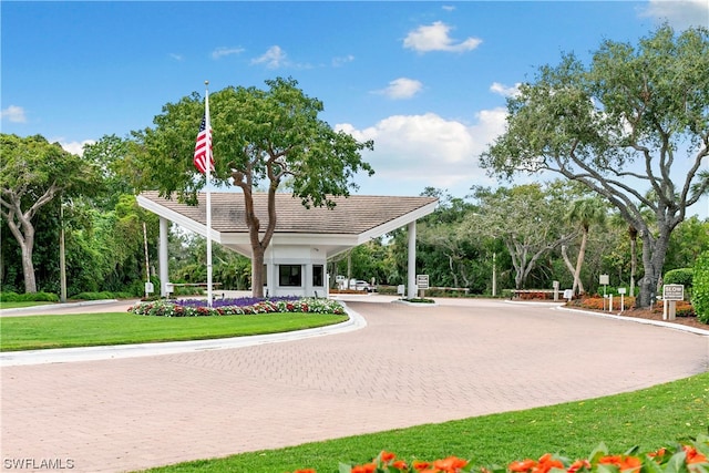 view of home's community with a lawn