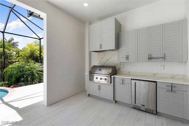 375 Periwinkle Ct, Marco Island, FL 34145 - kitchen featuring refrigerator, light stone counters, gray cabinets, and recessed lighting