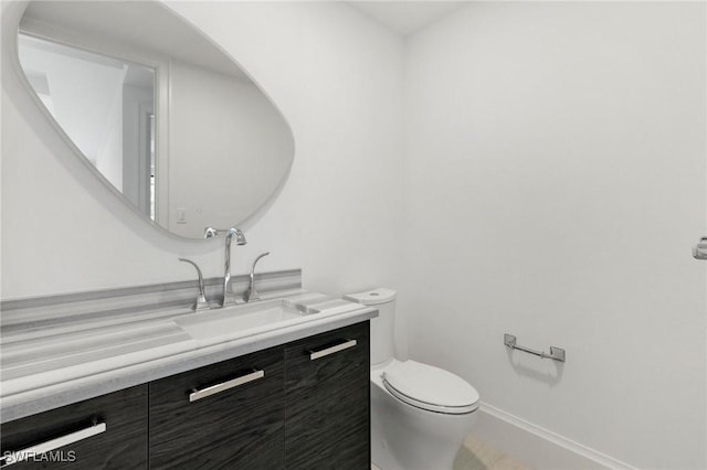 375 Periwinkle Ct, Marco Island, FL 34145 - half bath with toilet, baseboards, and vanity