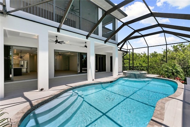 375 Periwinkle Ct, Marco Island, FL 34145 - view of swimming pool with a ceiling fan, glass enclosure, a patio, and a pool with connected hot tub