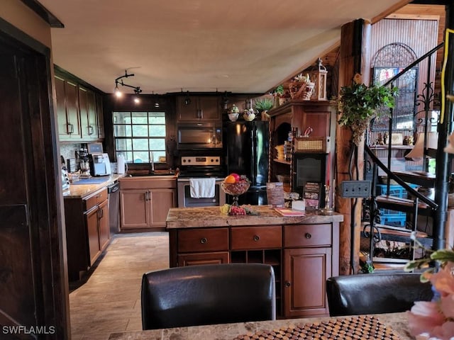 kitchen with sink, backsplash, and black appliances