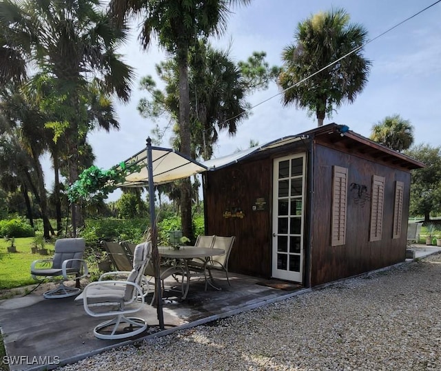 view of patio featuring an outdoor structure