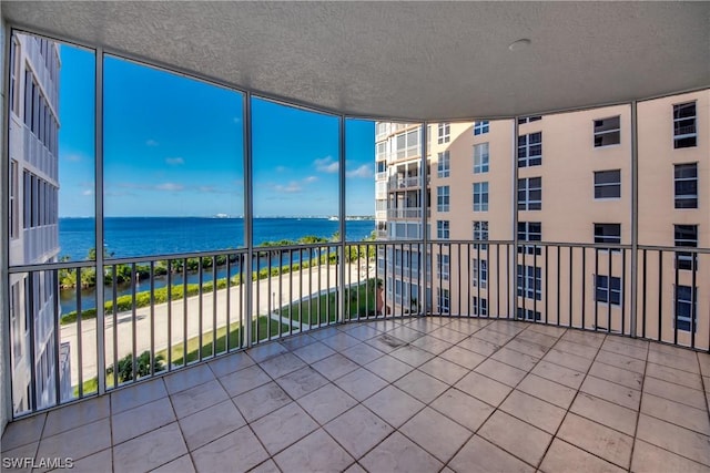 balcony featuring a water view