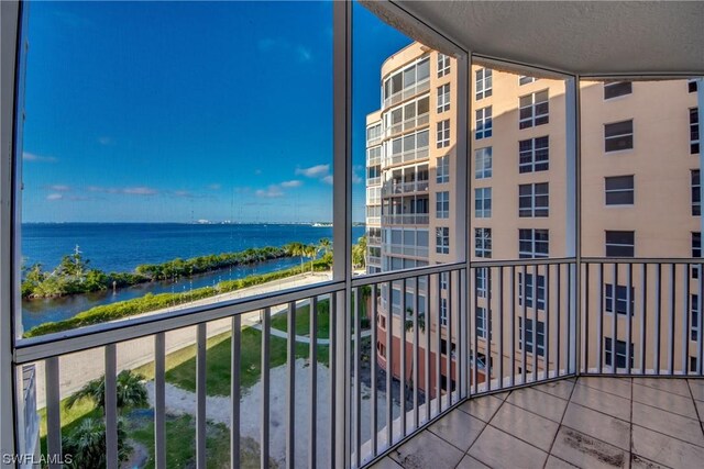 balcony featuring a water view