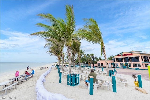 exterior space featuring a beach view and a water view