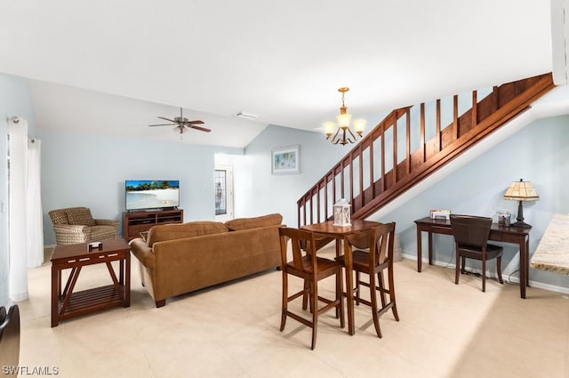 living room with ceiling fan with notable chandelier and lofted ceiling