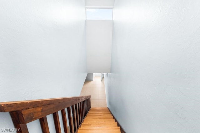 stairs featuring hardwood / wood-style flooring