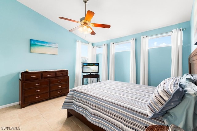 bedroom featuring light tile patterned floors, vaulted ceiling, and ceiling fan