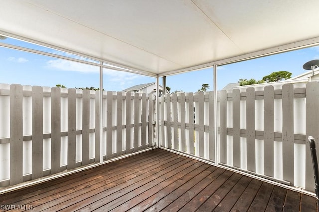 unfurnished sunroom featuring a healthy amount of sunlight