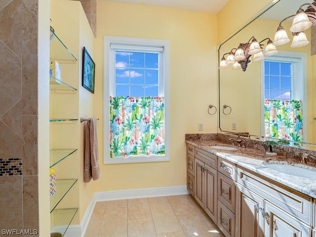 bathroom with tile patterned flooring and vanity