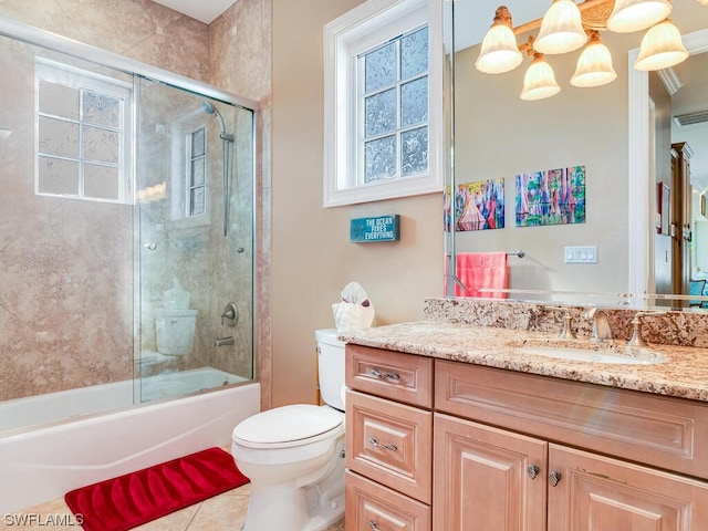 full bathroom with vanity, toilet, and enclosed tub / shower combo