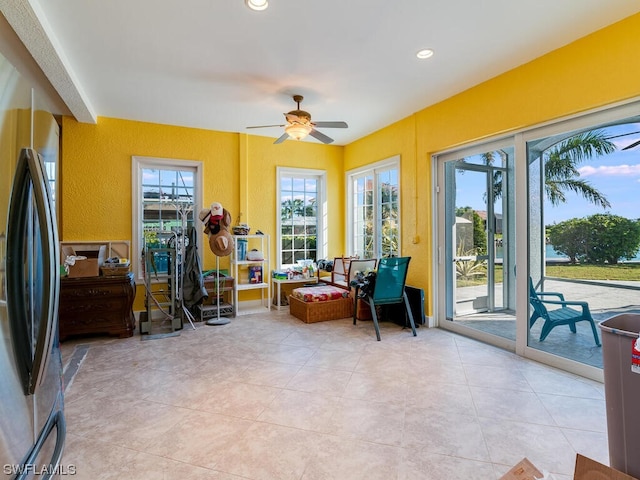 sunroom / solarium with ceiling fan