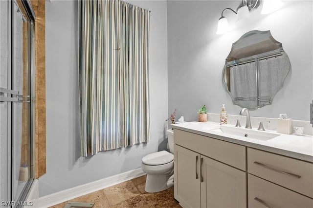 full bathroom featuring shower / bath combination with glass door, vanity, and toilet