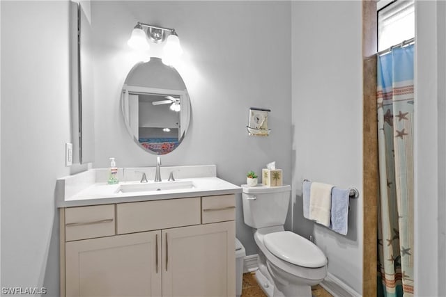 bathroom with vanity, toilet, and walk in shower