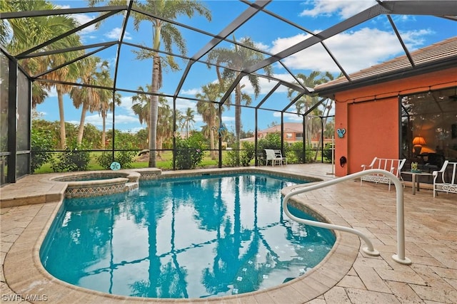 view of swimming pool featuring an in ground hot tub, a patio, and a lanai