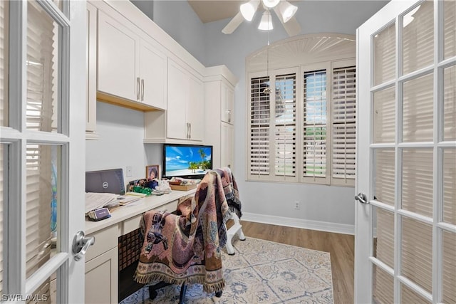 office with french doors, light wood-type flooring, and ceiling fan