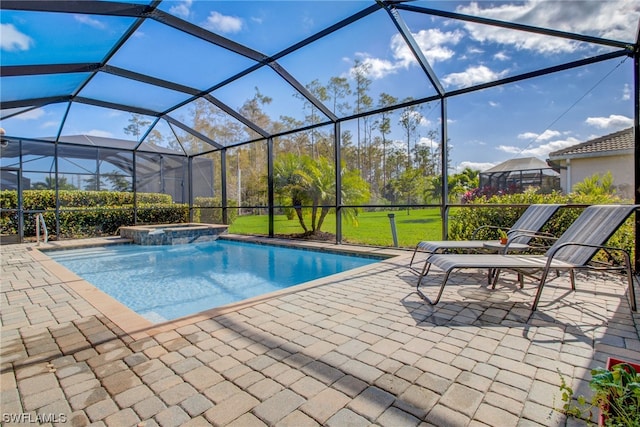 view of pool featuring a lanai, an in ground hot tub, and a patio