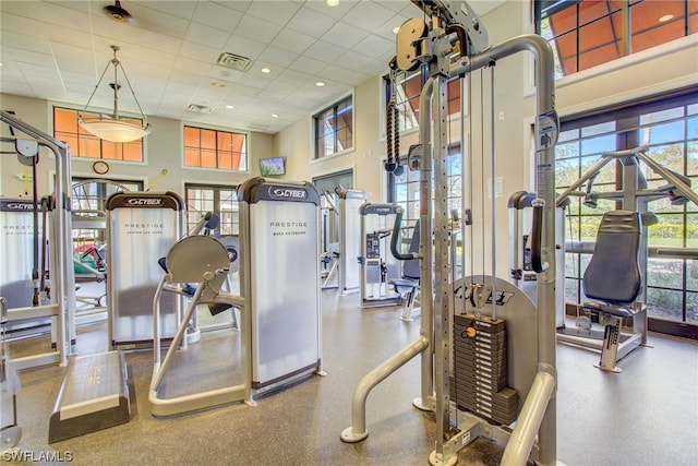 workout area with a paneled ceiling