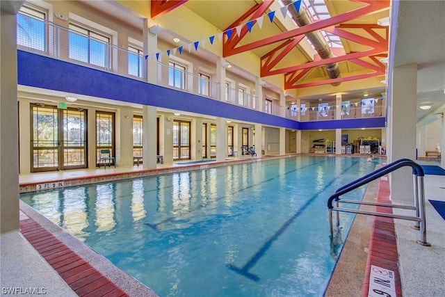 view of swimming pool featuring french doors