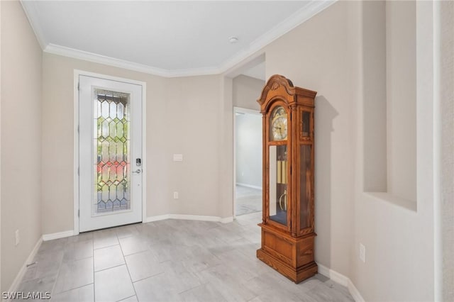 foyer featuring ornamental molding