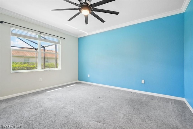 carpeted empty room with ceiling fan and ornamental molding