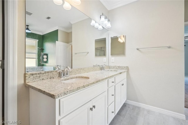 bathroom with vanity and ornamental molding