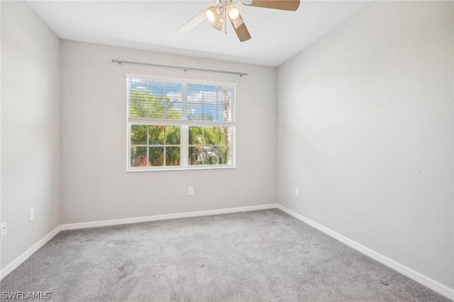 unfurnished room featuring carpet and ceiling fan