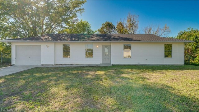 ranch-style home featuring a garage and a front lawn