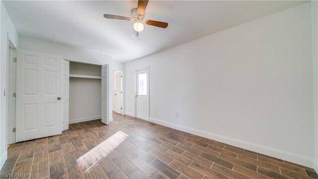 unfurnished bedroom featuring a closet, ceiling fan, and dark hardwood / wood-style floors