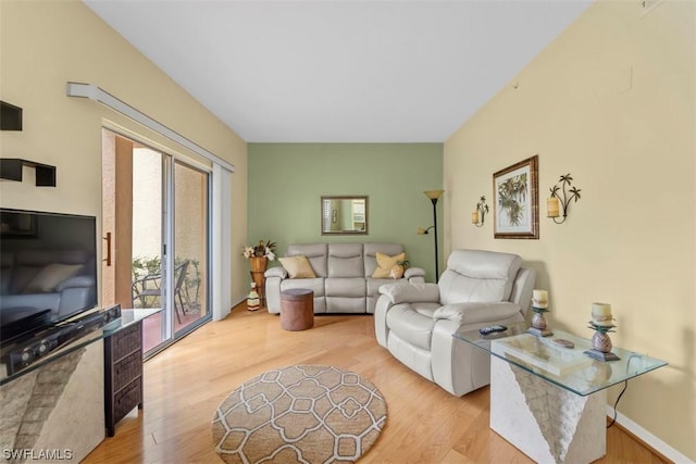 living room with light hardwood / wood-style flooring