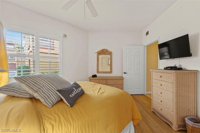 bedroom featuring ceiling fan and light hardwood / wood-style floors