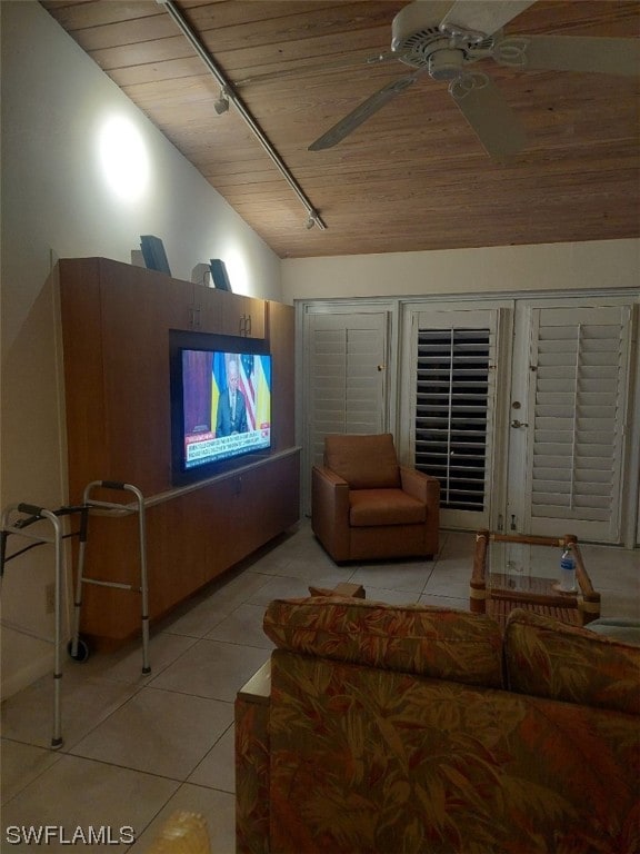 tiled living room with rail lighting, ceiling fan, and wood ceiling