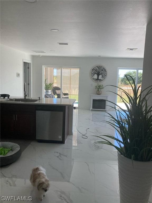 kitchen featuring stainless steel dishwasher and sink