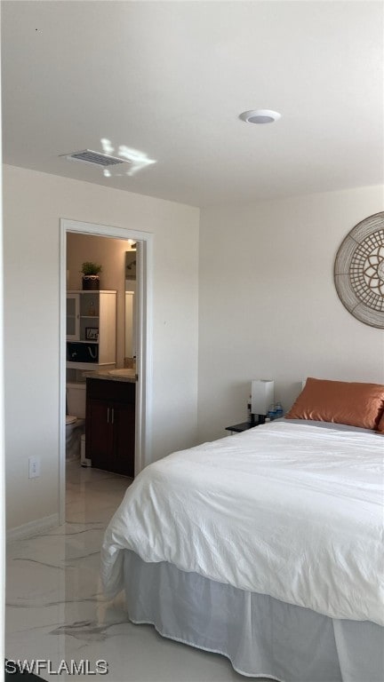 bedroom featuring ensuite bathroom