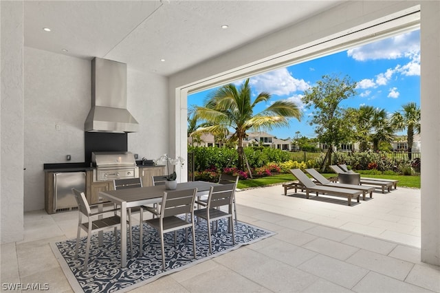 view of terrace featuring grilling area and an outdoor kitchen