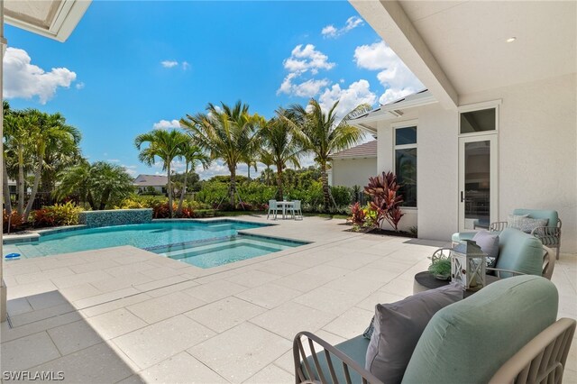 view of swimming pool featuring an outdoor living space and a patio area