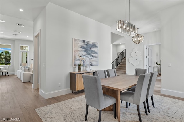 dining room with a chandelier and hardwood / wood-style floors