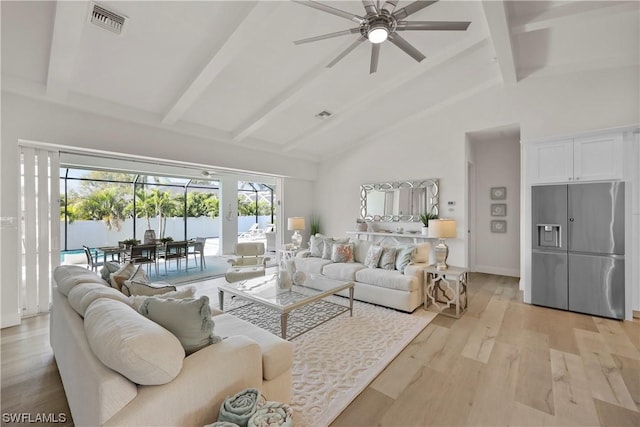 living room with beam ceiling, light wood-type flooring, high vaulted ceiling, and ceiling fan