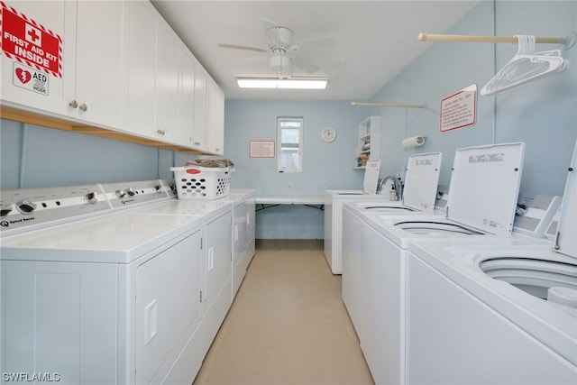 washroom with washer and clothes dryer, cabinets, and ceiling fan