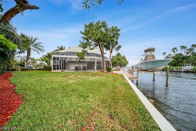 view of yard featuring a boat dock, a lanai, and a water view