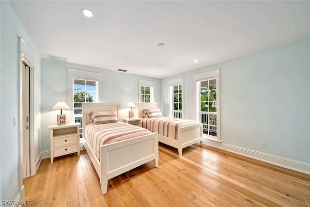 bedroom with light hardwood / wood-style floors