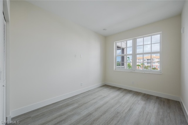 unfurnished room featuring light wood-type flooring