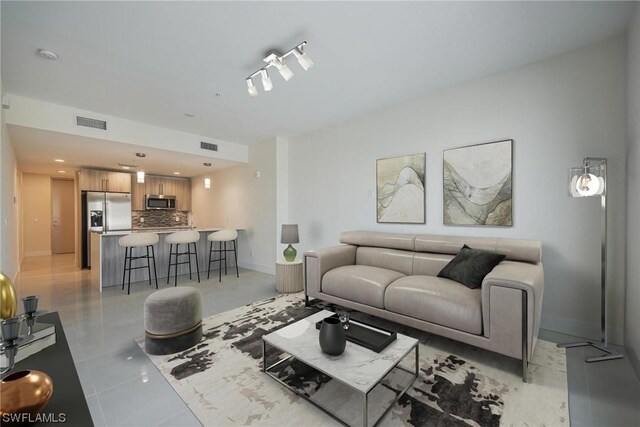 tiled living room with track lighting