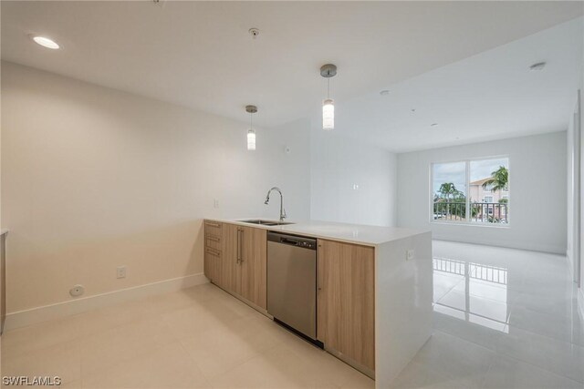 kitchen with stainless steel dishwasher, decorative light fixtures, light tile patterned flooring, sink, and kitchen peninsula