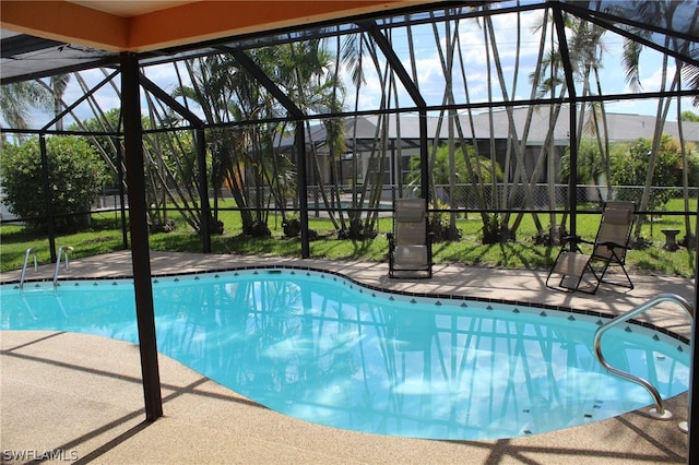 view of pool featuring a patio area and a lanai