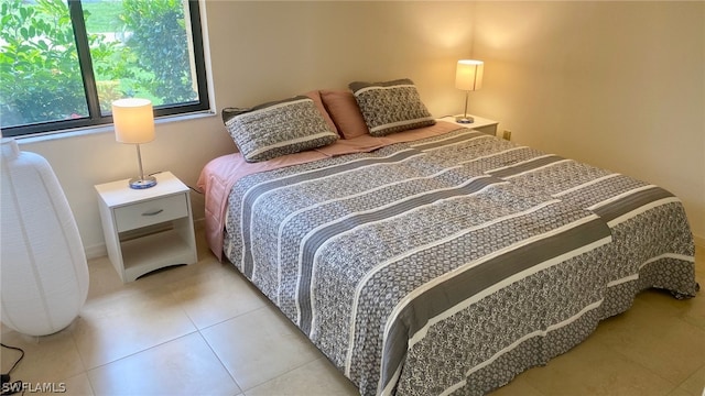 bedroom with light tile floors