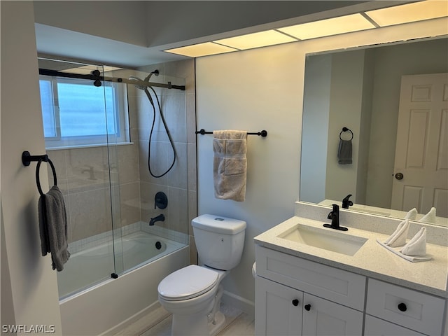 full bathroom featuring large vanity, toilet, and bath / shower combo with glass door