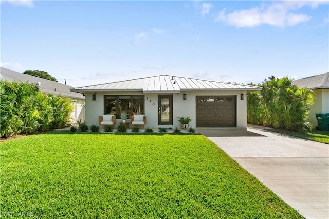 view of front facade with a garage and a front lawn